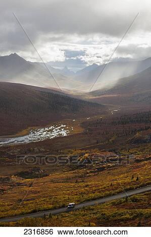 A Recreational Vehicle Drives On Dempster Highway Past Klondike Valley In Tombstone Territorial Park; Yukon Canada View Large Photo Image Stock Photograph - A Recreational Vehicle Drives On Dempster Highway Past Klondike Valley In Tombstone Territorial Park; Yukon Canada. Fotosearch