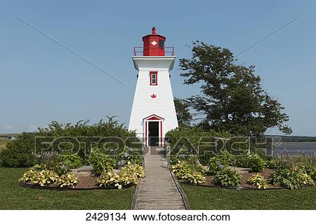 A red and white lighthouse on the Atlantic coast; Victoria, Prince Edward Island, Canada View Large Photo Image Picture - A red and white lighthouse on the Atlantic coast; Victoria, Prince Edward Island, Canada. Fotosearch