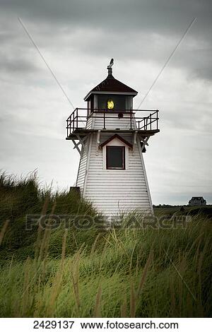 A red and white lighthouse on the Atlantic coast; Prince Edward Island, Canada View Large Photo Image Stock Photo - A red and white lighthouse on the Atlantic coast; Prince Edward Island, Canada. Fotosearch