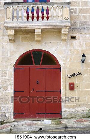 Picture - A Red Door On A Stone Building. Fotosearch