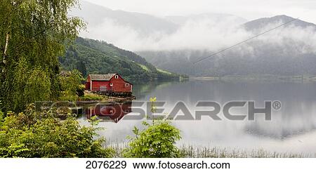 A Red House Along Granvinsvatnet With Low Lying Cloud; Granvin Hordaland Norway View Large Photo Image Stock Photo - A Red House Along Granvinsvatnet With Low Lying Cloud; Granvin Hordaland Norway. Fotosearch