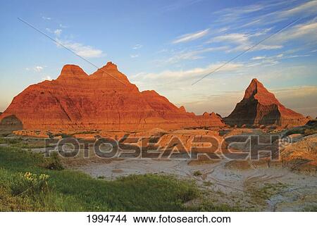 A Red Sunrise Illuminates The Hills In Badlands National Park; Dakota United States Of America View Large Photo Image Picture - A Red Sunrise Illuminates The Hills In Badlands National Park; Dakota United States Of America. Fotosearch