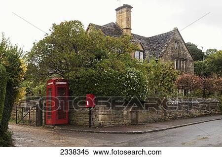 A Red Telephone Booth And Post Box Along A Street; England View Large Photo Image Stock Photography - A Red Telephone Booth And Post Box Along A Street; England. Fotosearch