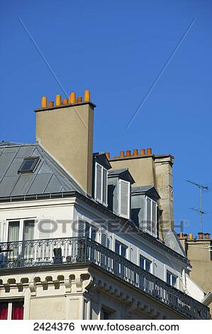 A residential building and blue sky; Paris, France View Large Photo Image Stock Photograph - A residential building and blue sky; Paris, France. Fotosearch