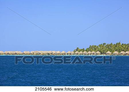 Stock Photograph - A Resort Along The Coast Of Motu Paahi Near Bora Bora Airport; Society Islands French Polynesia South Pacific. Fotosearch