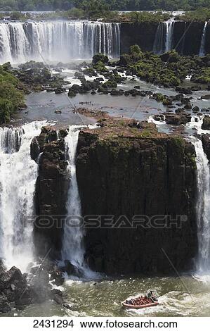 A RIB boat takes tourists to see the waterfalls from the Brazilian side of the river at Iguacu National Park; Brazil View Large Photo Image Picture - A RIB boat takes tourists to see the waterfalls from the Brazilian side of the river at Iguacu National Park; Brazil. Fotosearch