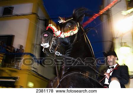 A rider rears up on his horse at the Fiesta de San Cristofol in a Menorcan village; Es Migjorn Gran, Spain View Large Photo Image Stock Photo - A rider rears up on his horse at the Fiesta de San Cristofol in a Menorcan village; Es Migjorn Gran, Spain. Fotosearch