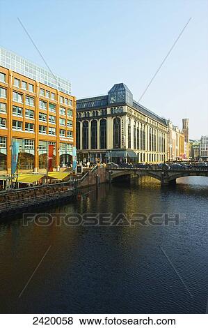 A road bridge crossing the river and buildings along the river; Hamburg, Germany View Large Photo Image Stock Photo - A road bridge crossing the river and buildings along the river; Hamburg, Germany. Fotosearch