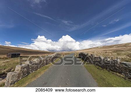 Stock Photo - A Road Lined With A Stone Wall; Swaledale England. Fotosearch
