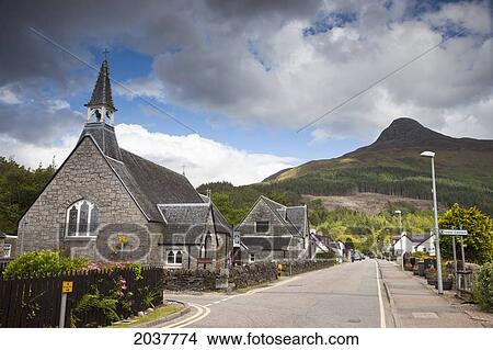 A Road Lined With Houses And A Church Building Going Through A Village; Glencoe Scotland View Large Photo Image Picture - A Road Lined With Houses And A Church Building Going Through A Village; Glencoe Scotland. Fotosearch