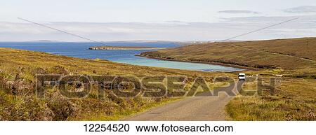 Stock Image - A road on Orkney Island; Orkney, Scotland. Fotosearch