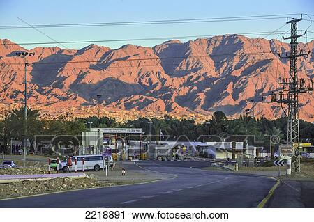 A Road Through A City With Mountains Against A Blue Sky; Jordan Israel View Large Photo Image Stock Image - A Road Through A City With Mountains Against A Blue Sky; Jordan Israel. Fotosearch