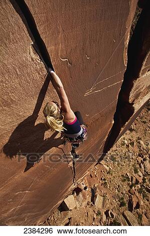 A rock climber on Blue Sun 5. 0; Indian Creek, Utah, United States of America View Large Photo Image Stock Photograph - A rock climber on Blue Sun 5. 0; Indian Creek, Utah, United States of America. Fotosearch