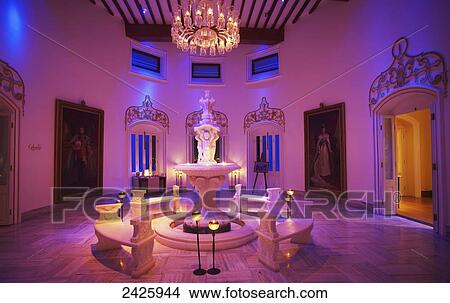 Picture - A room glowing with pink light in Falaknuma Palace; Hyderabad, Andhra Pradesh, India. Fotosearch