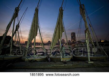 Stock Photography - A Row Of Small Boats Parked At A Dock. Fotosearch