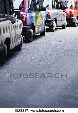 Stock Photo - A Row Of Taxis In Canary Wharf. Fotosearch