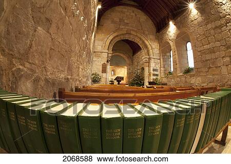 Stock Photo - A Row Of The New English Hymnals At The Back Of A Sanctuary; Northumberland England. Fotosearch
