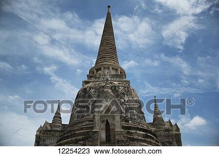Stock Image - A ruined temple in the ancient city of Ayutthaya in central Thailand; Ayutthaya, Thailand. Fotosearch