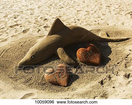 A sand sculpture of a fish with initials in heart shapes; Vina Del Mar, Valparaiso, Chile View Large Photo Image Stock Photograph - A sand sculpture of a fish with initials in heart shapes; Vina Del Mar, Valparaiso, Chile. Fotosearch