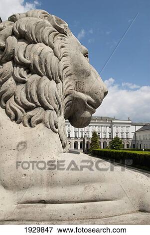 Stock Photo - A sculptured Lion in front of the Presidential Palace on Krakowskie Przedmiescie, Warsaw, Poland. Fotosearch