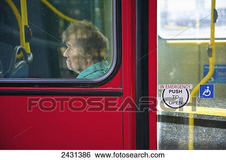 A senior woman rides a public city bus; London, England View Large Photo Image Stock Photograph - A senior woman rides a public city bus; London, England. Fotosearch