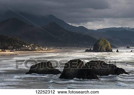 A shaft of sunlight brightens the Oregon coast; Cannon Beach, Oregon, United States of America View Large Photo Image Stock Image - A shaft of sunlight brightens the Oregon coast; Cannon Beach, Oregon, United States of America. Fotosearch