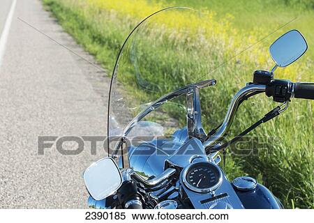 Stock Photography - A shiny dashboard on a motorcycle parked at the side of the road; East Selkirk, Manitoba, Canada. Fotosearch