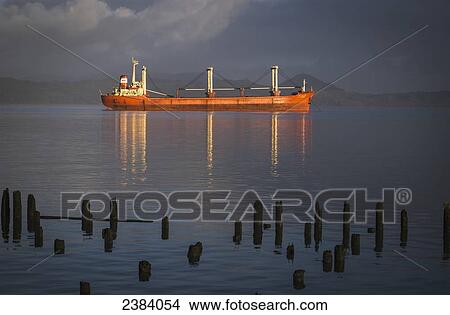 Picture - A ship anchors off the coast of Astoria; Astoria, Oregon, United States of America. Fotosearch
