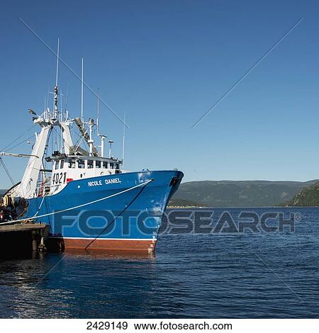 A ship at a dock, Gros Morne National Park; Newfoundland, Canada View Large Photo Image Stock Photo - A ship at a dock, Gros Morne National Park; Newfoundland, Canada. Fotosearch