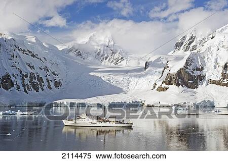 Stock Photography - A Ship Sailing Along The Coastline; Antarctica. Fotosearch