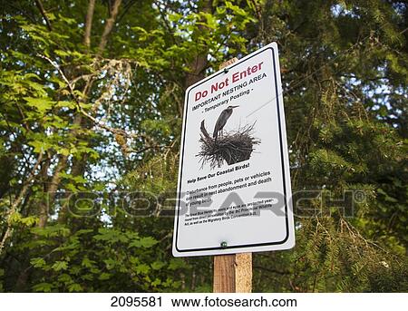 Stock Image - A Sign About Nesting Coastal Birds In The Cowichan Valley On Vancouver Island; British Columbia Canada. Fotosearch