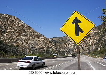Stock Image - A sign for a road merging; California, United States of America. Fotosearch