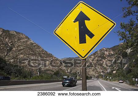 A sign for a road merging; California, United States of America View Large Photo Image Stock Image - A sign for a road merging; California, United States of America. Fotosearch