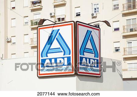 A Sign For A Supermarket On The Side Of A Building; San Fernando Andalusia Spain View Large Photo Image Picture - A Sign For A Supermarket On The Side Of A Building; San Fernando Andalusia Spain. Fotosearch