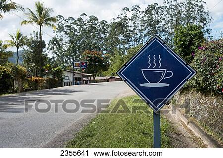 Stock Image - A Sign For Hot Coffee On The Roadside; Copan, Honduras. Fotosearch