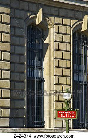 Picture - A sign for the Metro outside a stone building; Paris, France. Fotosearch