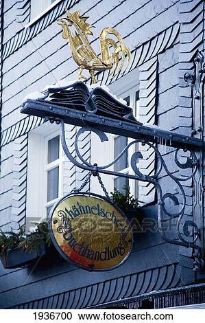 A Sign Hanging From A Building With A Golden Rooster; Hachenburg Rheinland-Pfalz Germany View Large Photo Image Stock Image - A Sign Hanging From A Building With A Golden Rooster; Hachenburg Rheinland-Pfalz Germany. Fotosearch