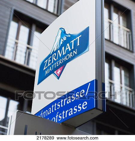 Stock Photo - A Sign In Front Of A Building For Zermatt Matterhorn; Zermatt Valais Switzerland. Fotosearch