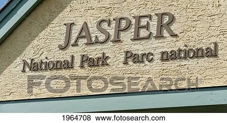 Stock Photo - A Sign On A Building For Jasper National Park; Jasper Alberta Canada. Fotosearch