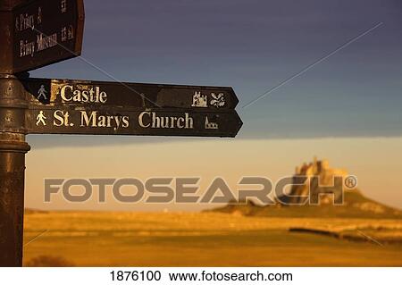 A Sign Post Pointing To A Castle And St. Marys Church On The Tidal Island, Also Known As Holy Island; Lindisfarne, Northumberland, England View Large Photo Image Stock Image - A Sign Post Pointing To A Castle And St. Marys Church On The Tidal Island, Also Known As Holy Island; Lindisfarne, Northumberland, England. Fotosearch