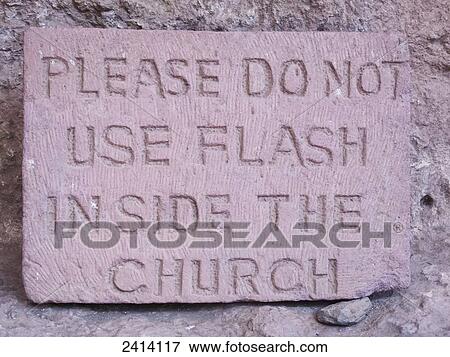 Stock Photo - A sign prohibiting the use of a camera flash inside the church, Beit Maryam rock-cut church; Lalibela, Amhara region, Ethiopia. Fotosearch