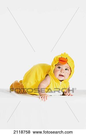 Stock Photo - A Six-Month-Old Girl In A Duck Halloween Costume; Fountain Valley California Usa. Fotosearch