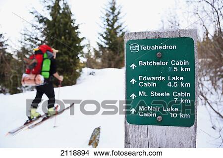 A Skier Ascending The Trail Enroute To Mount Steele Cabin In Tetrahedron Provincial Park; British Columbia Canada View Large Photo Image Picture - A Skier Ascending The Trail Enroute To Mount Steele Cabin In Tetrahedron Provincial Park; British Columbia Canada. Fotosearch