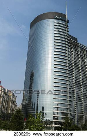 A Skyscraper With A Rounded Side Reflecting Other Buildings In The Glass Wall; Beijing, China View Large Photo Image Stock Photography - A Skyscraper With A Rounded Side Reflecting Other Buildings In The Glass Wall; Beijing, China. Fotosearch