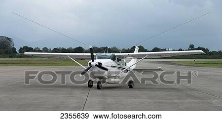 Stock Photo - A Small Plane On The Tarmac; La Lima, Cortes, Honduras. Fotosearch