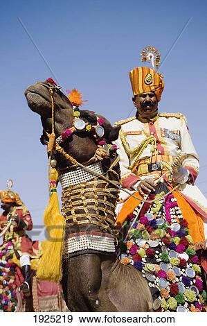 A Soldier Riding A Camel At The Jaisalmer Festival, Rajasthan, India View Large Photo Image Stock Photo - A Soldier Riding A Camel At The Jaisalmer Festival, Rajasthan, India. Fotosearch