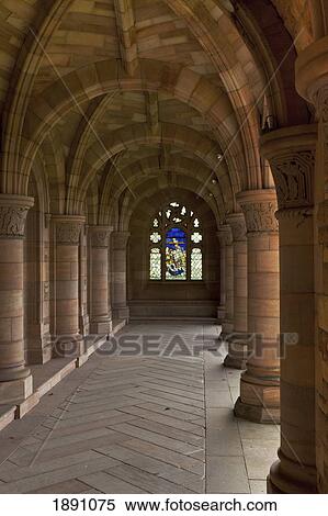 Stock Photography - A Stained Glass Window At The End Of An Outdoor Corridor With Arches And Columns; Scottish Borders, Scotland. Fotosearch