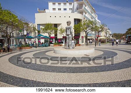 Picture - A Statue In The Middle Of A Public Pedestrian Path; Lagos Algarve Portugal. Fotosearch