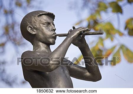 A Statue Of A Boy Playing A Piccalo; Tivoli Park, Ljubljana, Slovenia View Large Photo Image Stock Image - A Statue Of A Boy Playing A Piccalo; Tivoli Park, Ljubljana, Slovenia. Fotosearch