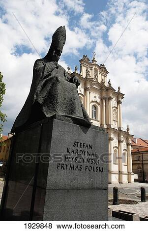 A statue of Cardinal Stefan Wyszynski, primate of Poland from 1948 to 1981 in front of the Rococo-styled (late-Baroque) Roman Catholic Church of St Joseph of the Visitationists, on Krakowskie Przedmiescie, Warsaw, Poland View Large Photo Image Stock Photo - A statue of Cardinal Stefan Wyszynski, primate of Poland from 1948 to 1981 in front of the Rococo-styled (late-Baroque) Roman Catholic Church of St Joseph of the Visitationists, on Krakowskie Przedmiescie, Warsaw, Poland. Fotosearch